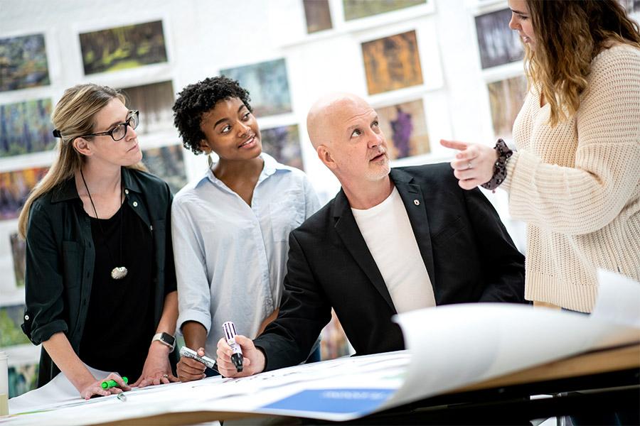 Group of people talking and planning